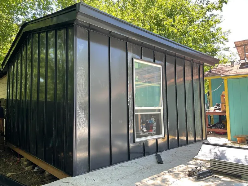 Black standing seam metal wall panels for Roof Inspection in Ferndale